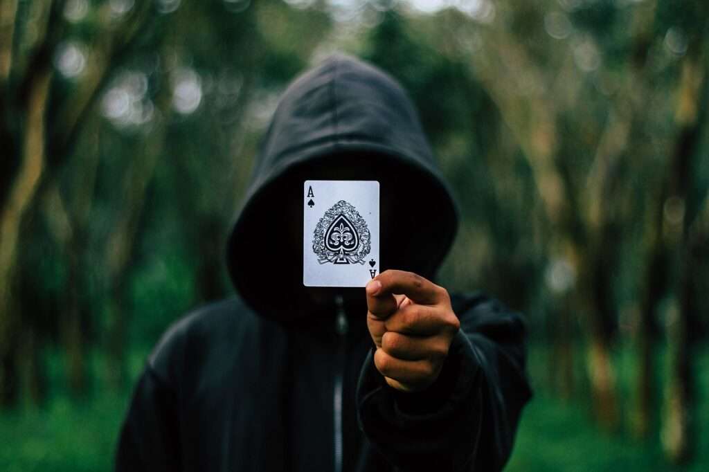 Photo by Pexels ace, cards, hooded