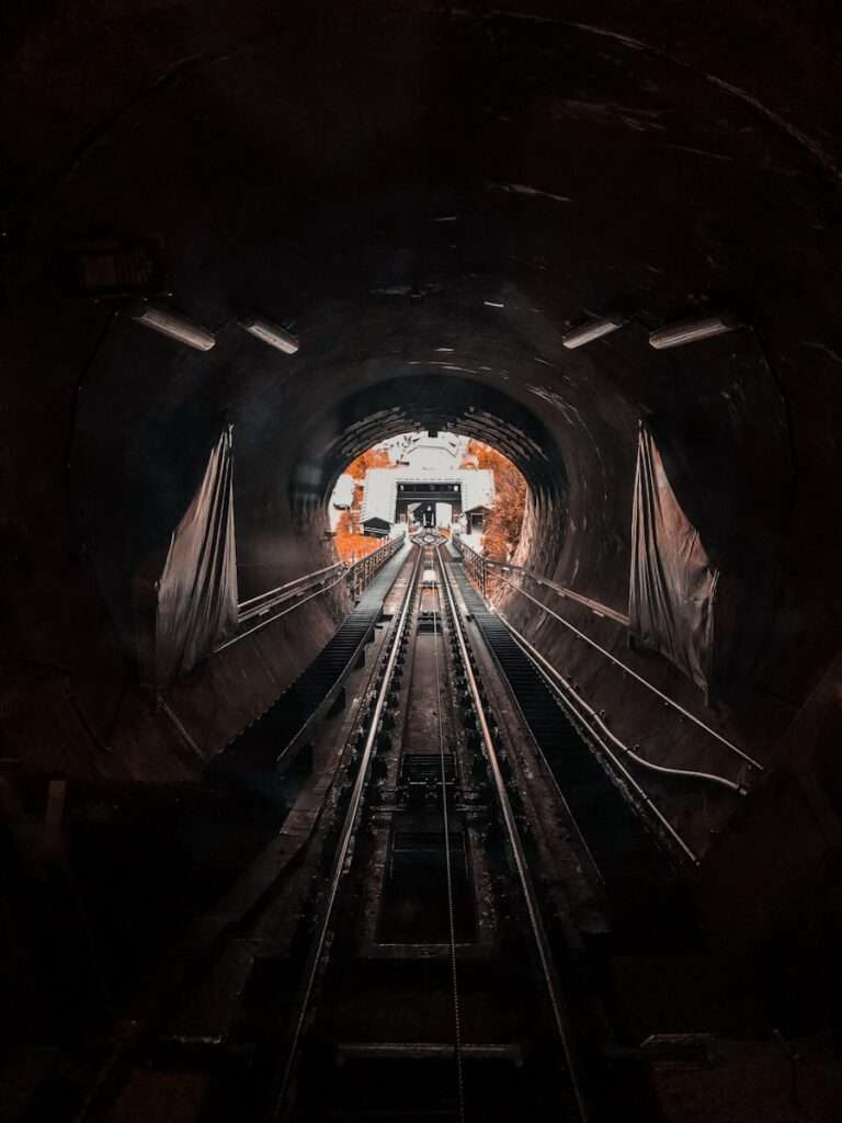 people walking on tunnel during daytime